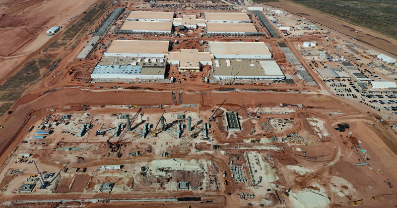 A Crusoe Energy data centre in Abelene, Texas. An aerial shot of two huge warehouse complexes in the desert, with a third being built